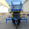 The electric tricycle lift can raise the vehicle to a height of four meters.